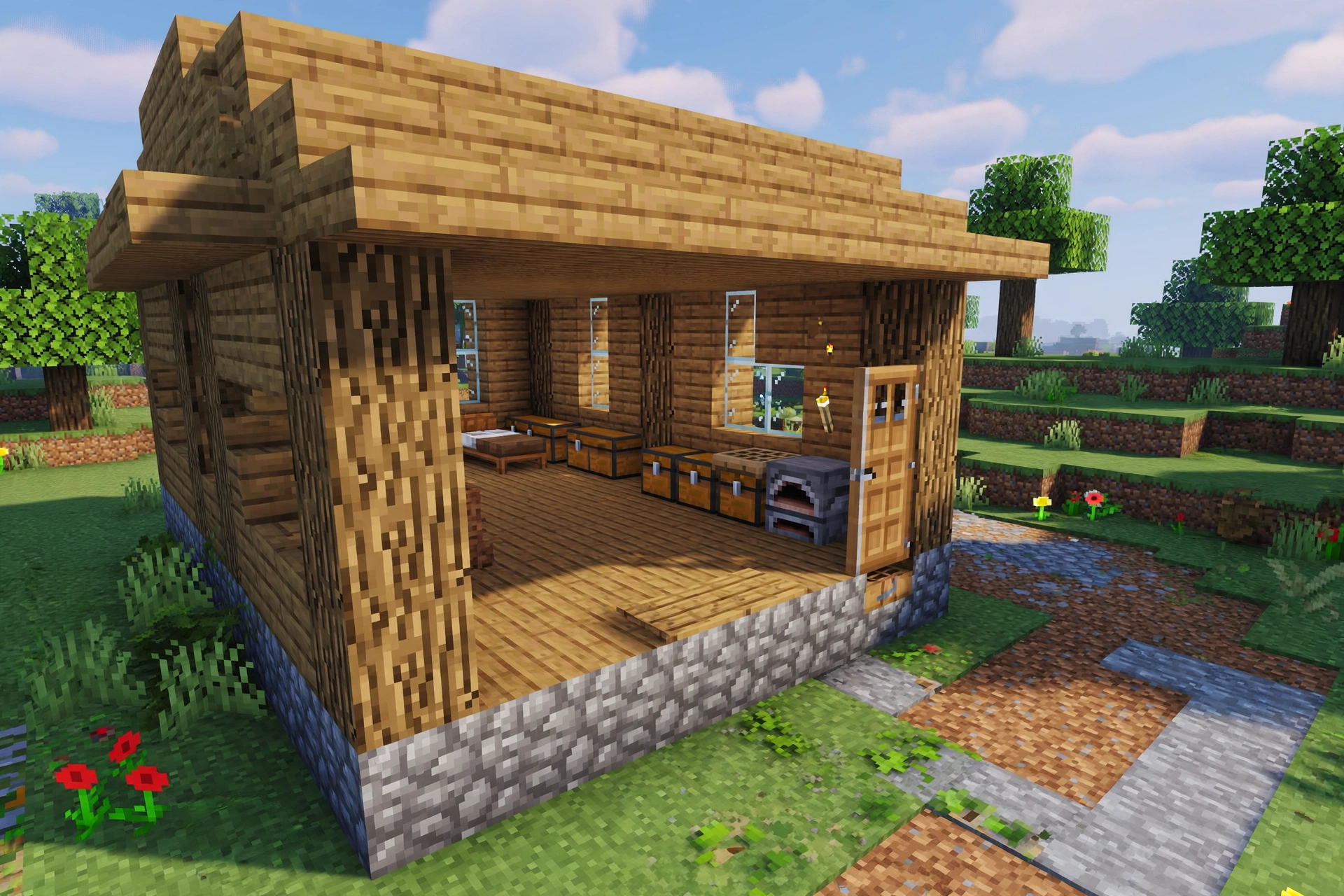 A Minecraft starter house showing bed, chests, crafting table and furnace arranged with clear floor space.